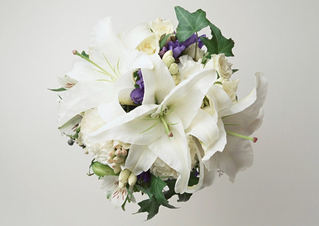 A bouquet of white sympathy lilies